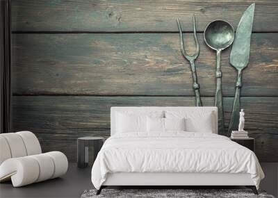 Stylized cutlery on rustic table top view with copy space, local food concept. Wall mural