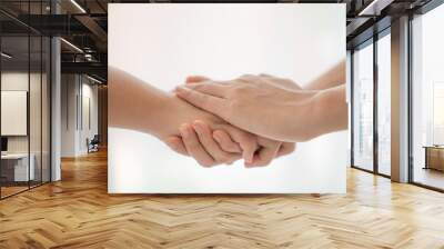 World peace concept.Two people holding hand together over blurred white background with copy space,Business man and woman shaking hands,helping hand. Wall mural