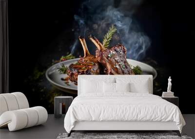 Two roasted lamb chops on a white plate with sprigs of rosemary and other herbs, emitting steam. Wall mural