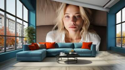 A tired, exhausted blonde hair 20-year-old girl in white shirt about to fall asleep. generative AI Wall mural