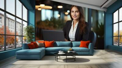 Happy young business woman entrepreneur in office using laptop at work, smiling professional female company executive wearing suit working on computer at workplace. generative AI Wall mural