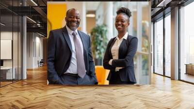 smiling black businessman and businesswoman in a suit standing, on a office interior background. Business success concept. a male manager and a female director in a modern office space. generative AI Wall mural