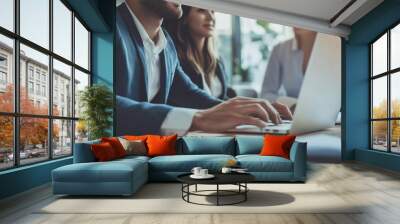 Two happy professional business man and woman executive leaders team using laptop working on computer at work desk having conversation on financial project at meeting in office. Wall mural