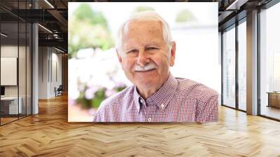 portrait of senior man look in to the camera and relaxed Wall mural