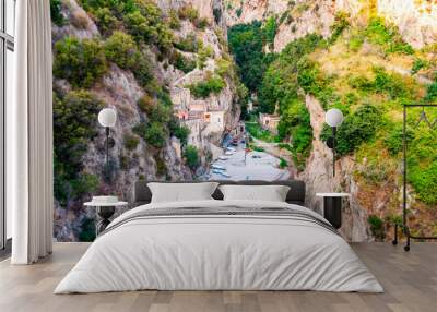 Amazing small beach in high rocky mountains gorge. Several village houses built on the rocks. Tyrrhenian sea bay in Campania region called Fiordo di Furore Wall mural