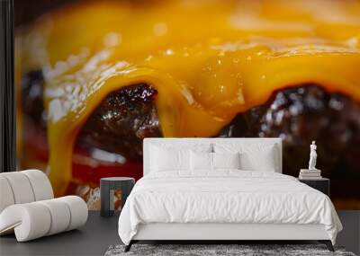 Close up of melted cheddar cheese dripping off a juicy hamburger on a toasted bun Wall mural