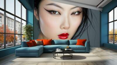 Closeup of a beautiful asian woman featuring dramatic eyeliner and vibrant red lips Wall mural