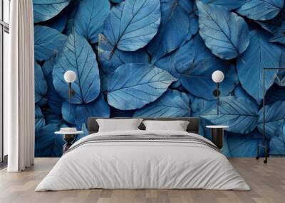 Intricate network of blue leaves creating a textured natural background Wall mural