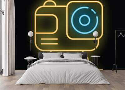 Yellow and blue neon icon of an action camera glowing on a black background Wall mural