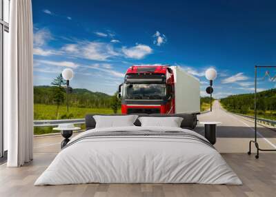 Red truck on a road in summer Wall mural