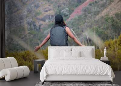 Hermosas montañas y mujer joven  con short y mochila  en el camino concepto de turismo. Paisaje con chica deportiva con top en la cima de la montaña, bosque, colinas, cielo blancos con nubes, Viaje, Wall mural