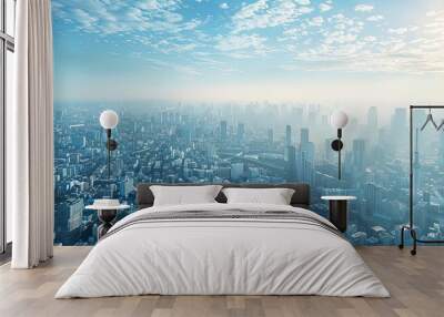 aerial  dynamic cityscapes featuring a towering cityscape against a clear blue sky Wall mural