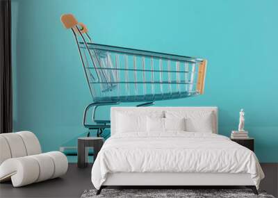 Online Shopping Concept: Empty Shopping Cart on Laptop Wall mural