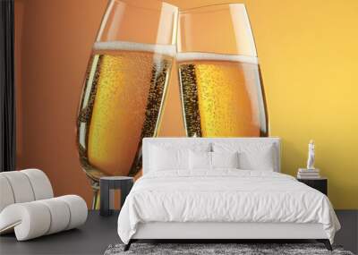 Two Champagne Glasses with Bubbles on Gold Background Wall mural