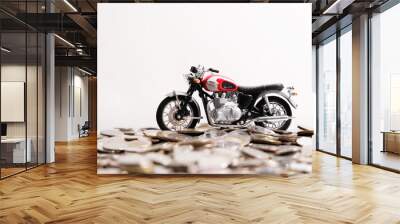 Modern classic motorcycle model on many of coins background, Finance concept. Wall mural