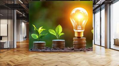  A light bulb glowing over stacks of coins with green plants growing out, symbolizing energy security and financial growth in the world of renewable energy business.  Wall mural