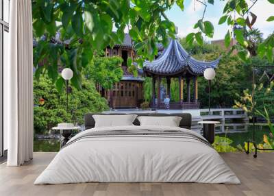 Lan Su Chinese Garden in summer season. Garden Pavilion reflects in pond Wall mural