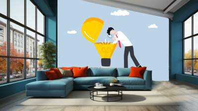 Business insight, deep understanding to make decision better, in-depth analysis for competitive advantage concept, Businessman looking into light bulb inside. Wall mural