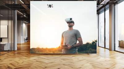 Drone pilot with virtual reality headset making photos and videos Wall mural