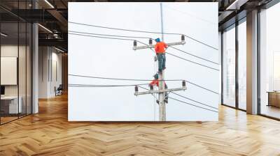 electrician lineman repairman worker at climbing work on electri Wall mural