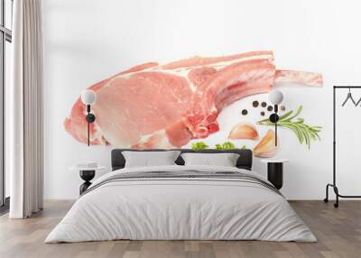 Raw pork chops and vegetables on white background Wall mural