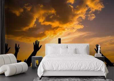 Hands raised in worship in front of a cross at sunset (14) Wall mural