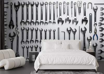 This image displays an assortment of tools including wrenches, screwdrivers, and pliers, organized on a white background, symbolizing repair, construction, and utility (12) Wall mural