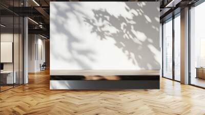 Empty wooden tabletop on white wall with tree shadow background for displaying product design Wall mural