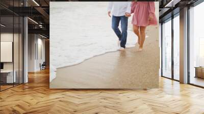 couple and girl walking on the beach  Wall mural