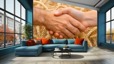 farmers shaking hands in front of a wheat field, symbolizing trust, cooperation, and successful partnership in agriculture. This image captures the essence of teamwork and mutual respect Wall mural