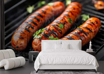 Hot, tasty grilled sausages sizzling on a charcoal grill with smoke rising, evoking a sense of warmth, outdoor cooking, and the rich, savory aroma of perfectly cooked meat Wall mural