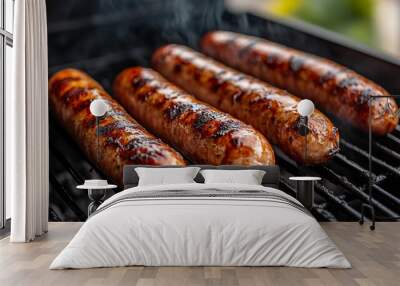 Hot, tasty grilled sausages sizzling on a charcoal grill with smoke rising, evoking a sense of warmth, outdoor cooking, and the rich, savory aroma of perfectly cooked meat Wall mural