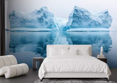 iceberg floats serenely in crystal-clear water, its white surface gleaming under sunlight. The submerged portion hints at its hidden depth, symbolizing unseen potential and mystery beneath the surface Wall mural