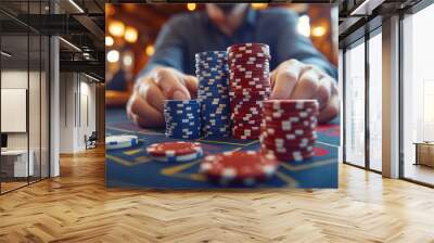 man's hands holding a stack of colorful poker chips at a casino table. The image conveys tension, strategy, and the thrill of gambling and risk-taking Wall mural