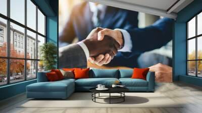 Professional handshake between businessmen symbolizing agreement and partnership in a corporate setting Wall mural