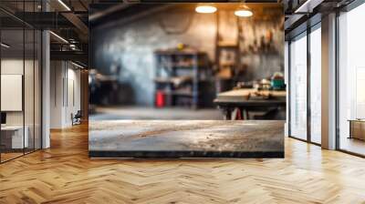 Rough metal workshop desk on blurred garage backdrop, symbolizing industrial creativity craftsmanship. Copy space available Wall mural