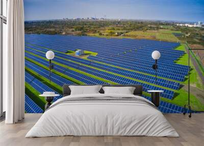 Fly over a renewable solar power plant with sun in Ukraine Wall mural