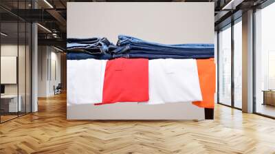 Set of Colorful polo t-shirts and many shades of blue jeans trousers   isolated in style light jeans and dark jeans , Fashion trends of  denim jean pants, fashion tops concept  Wall mural