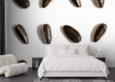 Black sunflower seeds isolated on white background. Raw whole grain Wall mural