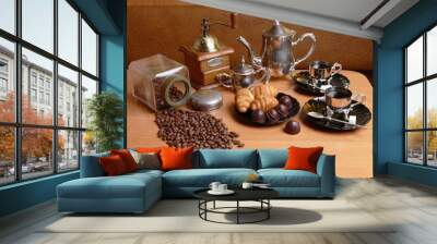 Coffee still life. Two cups of coffee, a coffee grinder, a coffee pot, a sugar bowl, a saucer of croissants, and a jar of coffee beans. Wall mural