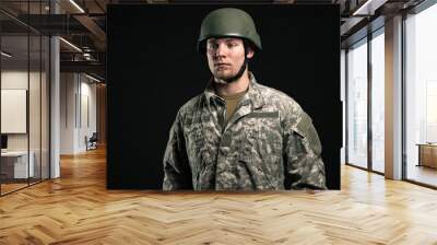 Military young man wearing helmet. Studio portrait. Wall mural