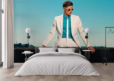 Retro fifties summer fashion man with white suit and sunglasses. Wall mural