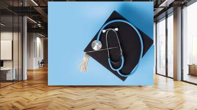 Medical education, graduation cap and doctor's stethoscope, student completing degree in medicine, college ceremony recognizing academic success Wall mural