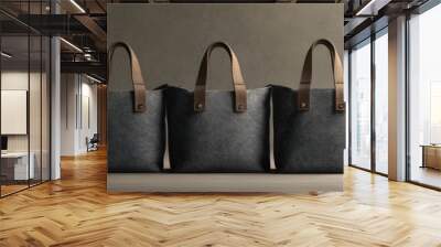 Elegant collection of three stylish tote bags, showcasing modern design and craftsmanship against a subtle background. Wall mural