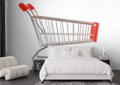 Shopping Cart Ready for Action: A sleek, chrome shopping cart with red handles stands ready for its next adventure, symbolizing the excitement of consumerism and the thrill of the shopping experience. Wall mural