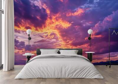 a sunset sky deep orange and pink hues blending with darker purples as the day turns to night. Wall mural