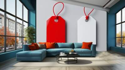 Two blank price tags with red string, one red and one white, isolated on gray background. Wall mural