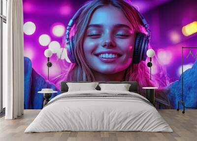 A young woman enjoys music with headphones, smiling amidst vibrant, colorful lights. Wall mural