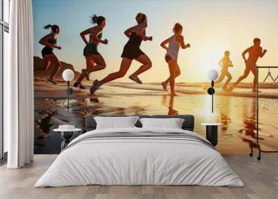 Group of young people running on beach at sunset. healthy holiday concept Wall mural