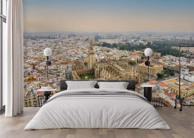 The drone aerial view of Seville Cathedral (Catedral de Santa Maria de la Sede de Sevilla) at sunrise, Seville, Spain. Wall mural